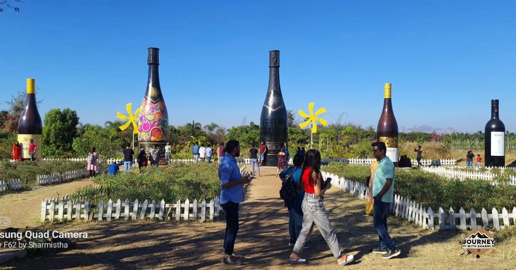 Giant bottles, sunny skies, and vineyard strolls