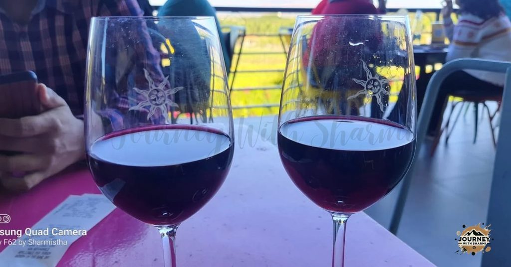 Sipping red wine with a front-row view of the vines.